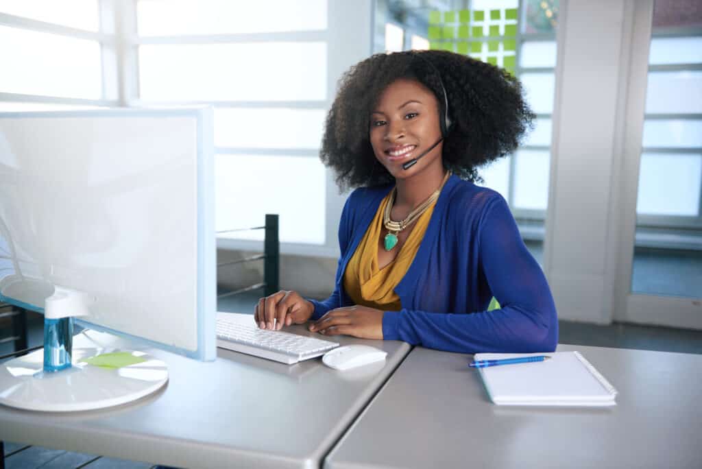 businesswoman taking a call from someone who read a great piece of SEO content