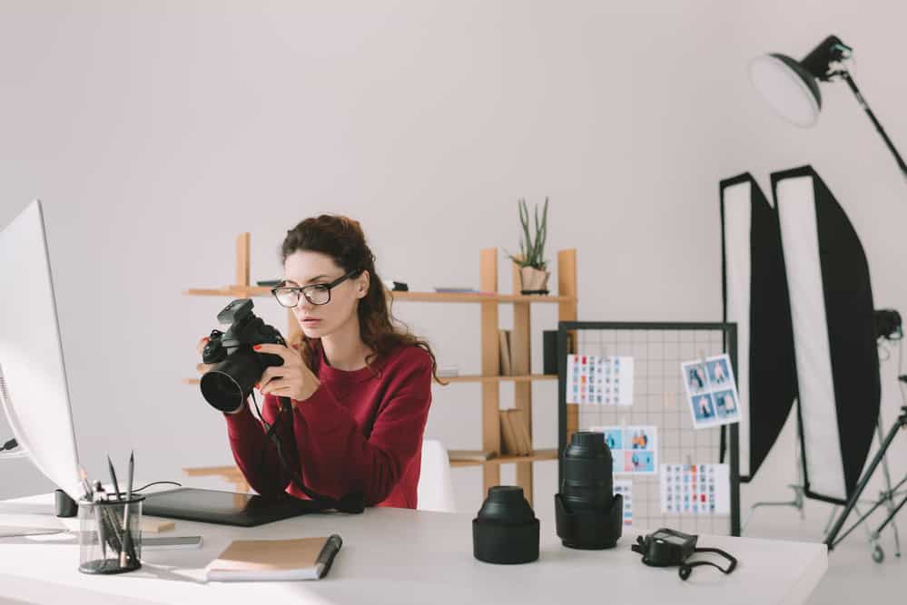 A photographers hires SEO services so she can focus on her work. 